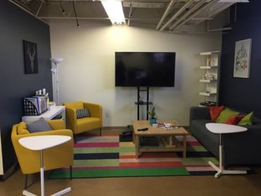 Vibrant modern office waiting area remodeled by shield commercial construction